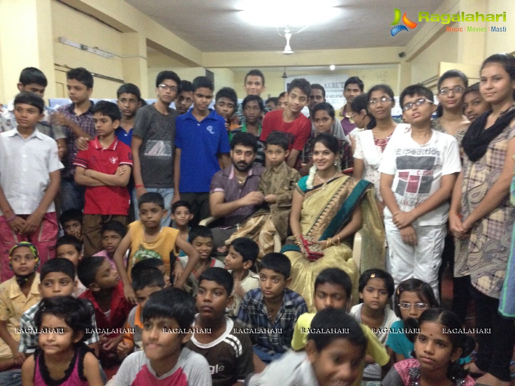 Madhumitha, Sivabalaji with their son Dhanvin at Ashray Akruti