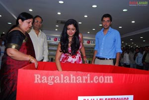 Poonam Bajwa anounces the Bajaj Electronics Bumper Draw Winner